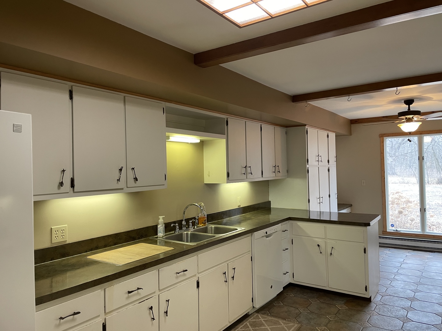 5650 West Bluff Road Morris, IL 60450 - Photo 9 of 53 a kitchen with granite countertop white cabinets and white appliances