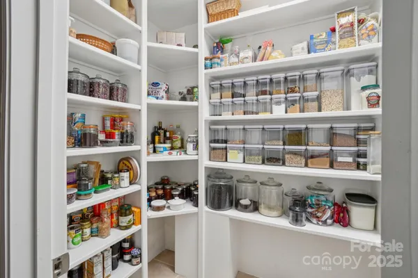 a room with a book shelf and a book shelf