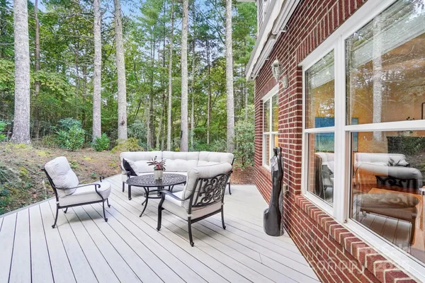 a view of a patio with a table and chairs