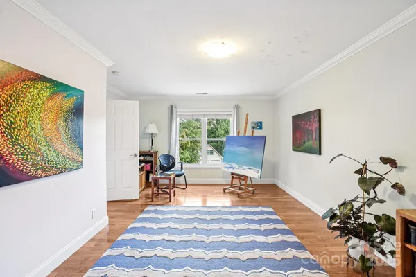 a living room with furniture rug and window