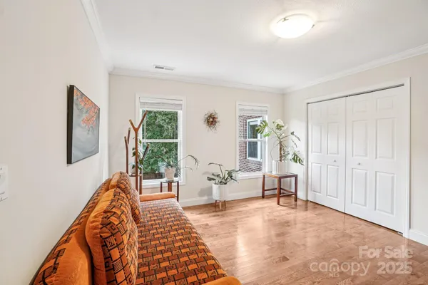 a bedroom with furniture and a window