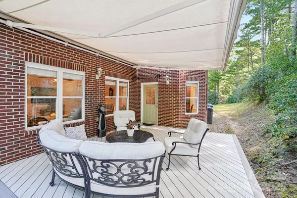 a view of a house with a table and chairs