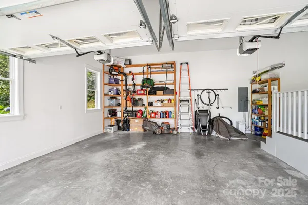 a view of a garage with rack and bicycle