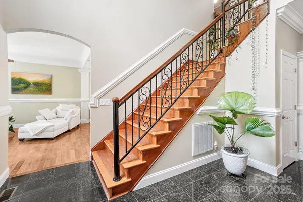 a view of entryway with wooden floor