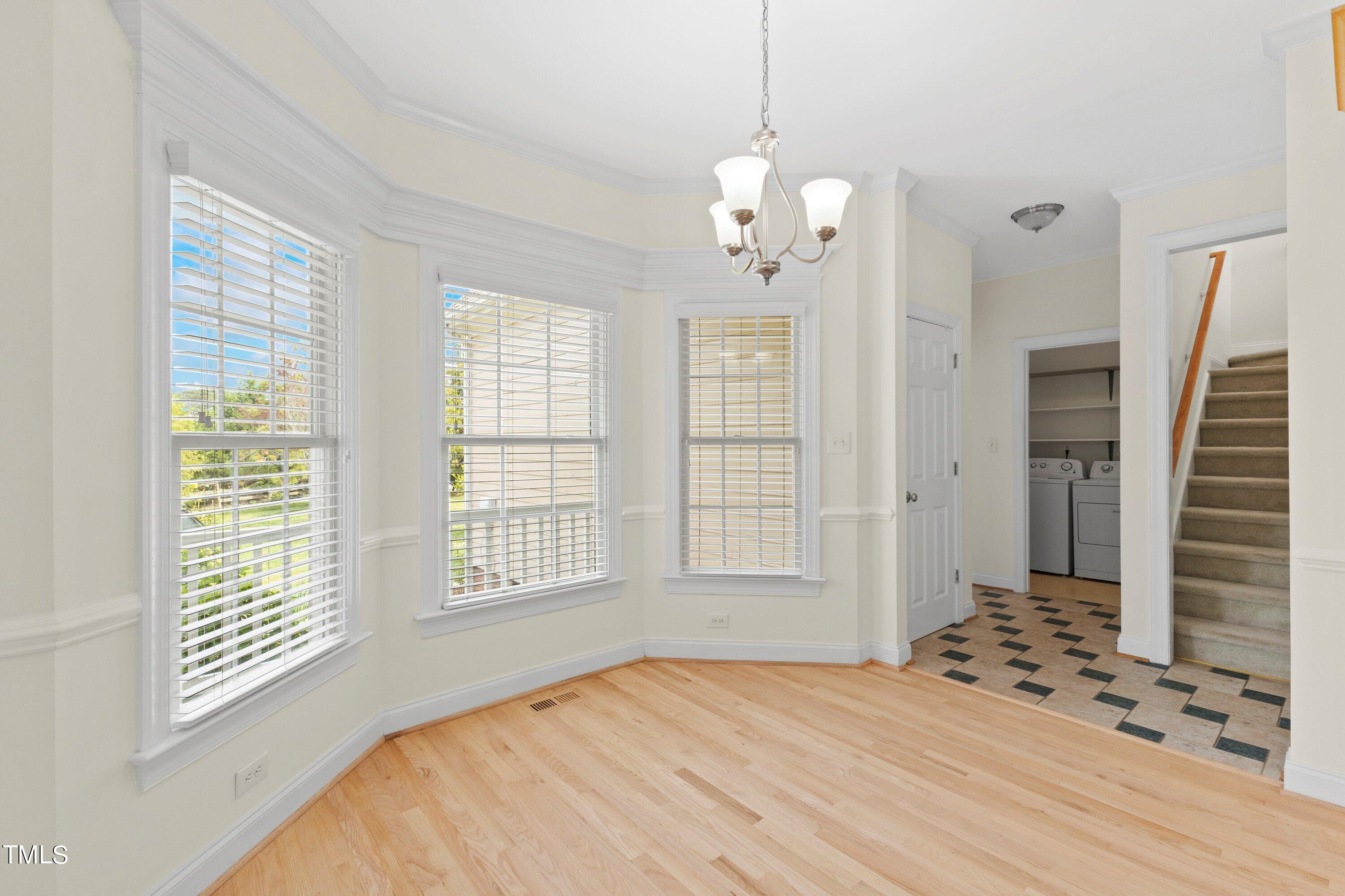 1004 Pasture View Lane Raleigh, NC 27603 - Photo 19 of 48 Breakfast room. The owner's bedroom is down the back hallway and up the stairs is the bonus room.