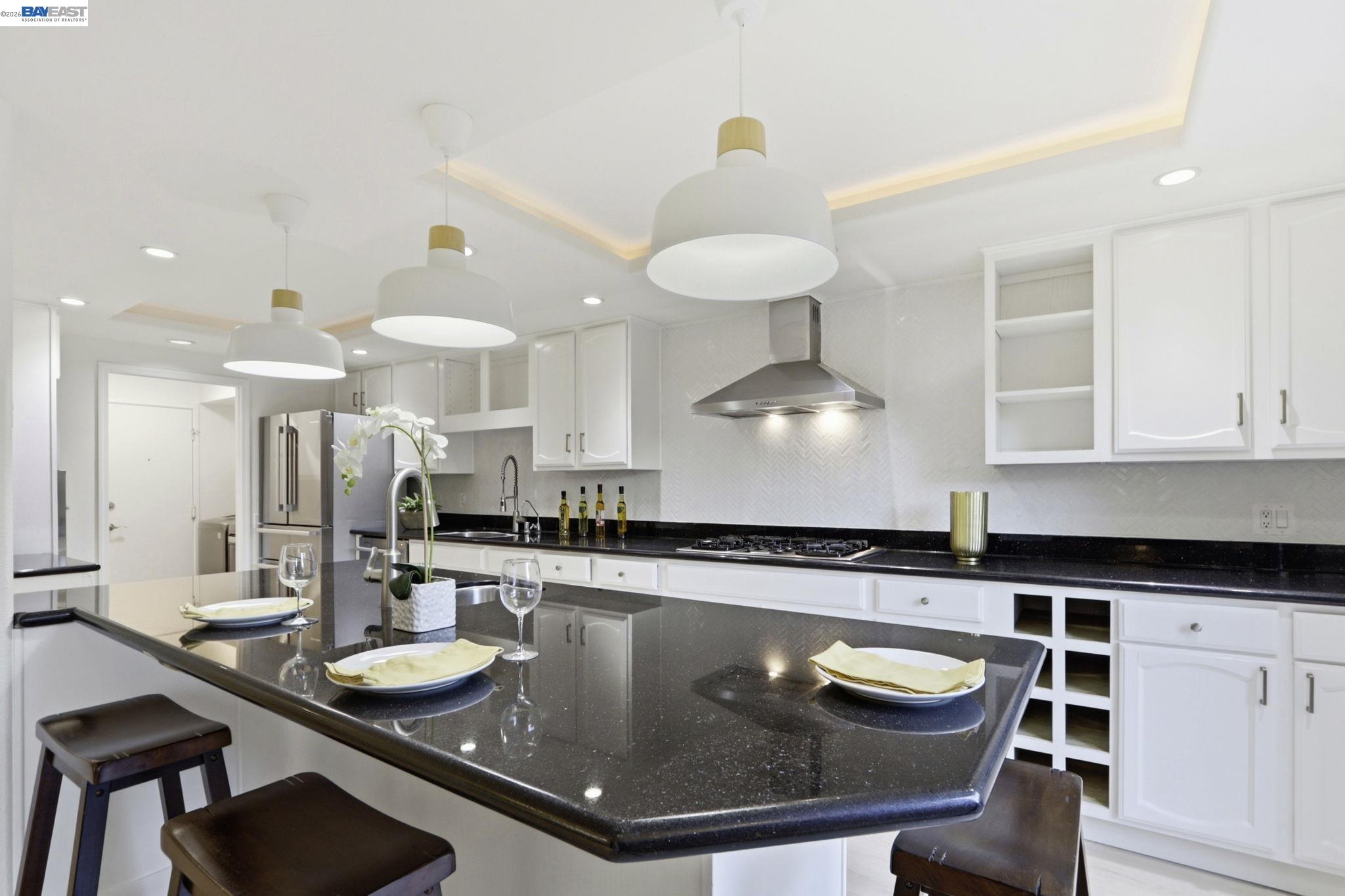 60 Jacklin Place Milpitas, CA 95035 - Photo 13 of 45 a kitchen with stainless steel appliances granite countertop a sink a stove and chairs