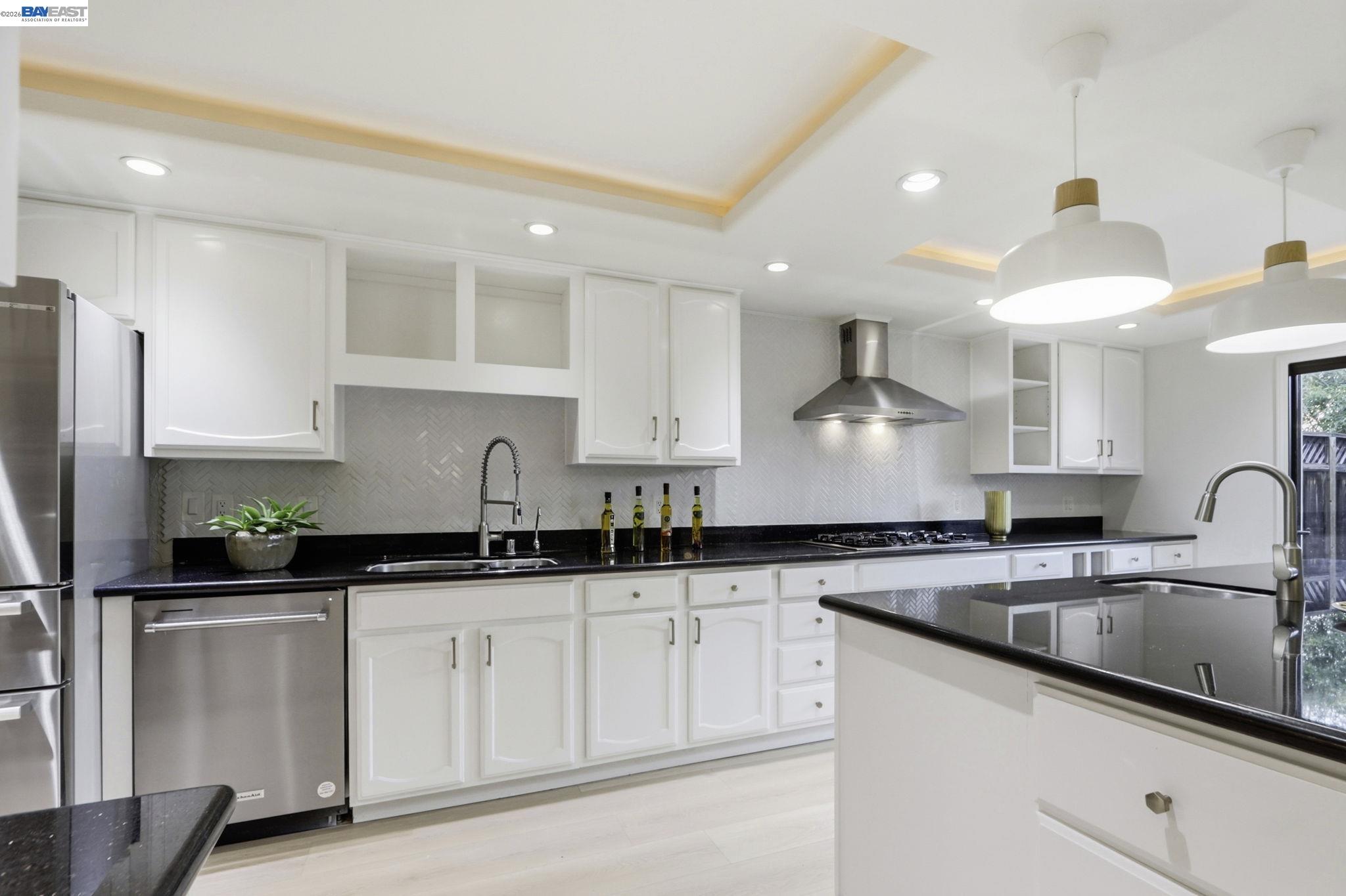 60 Jacklin Place Milpitas, CA 95035 - Photo 17 of 45 a kitchen with granite countertop a sink stainless steel appliances and cabinets