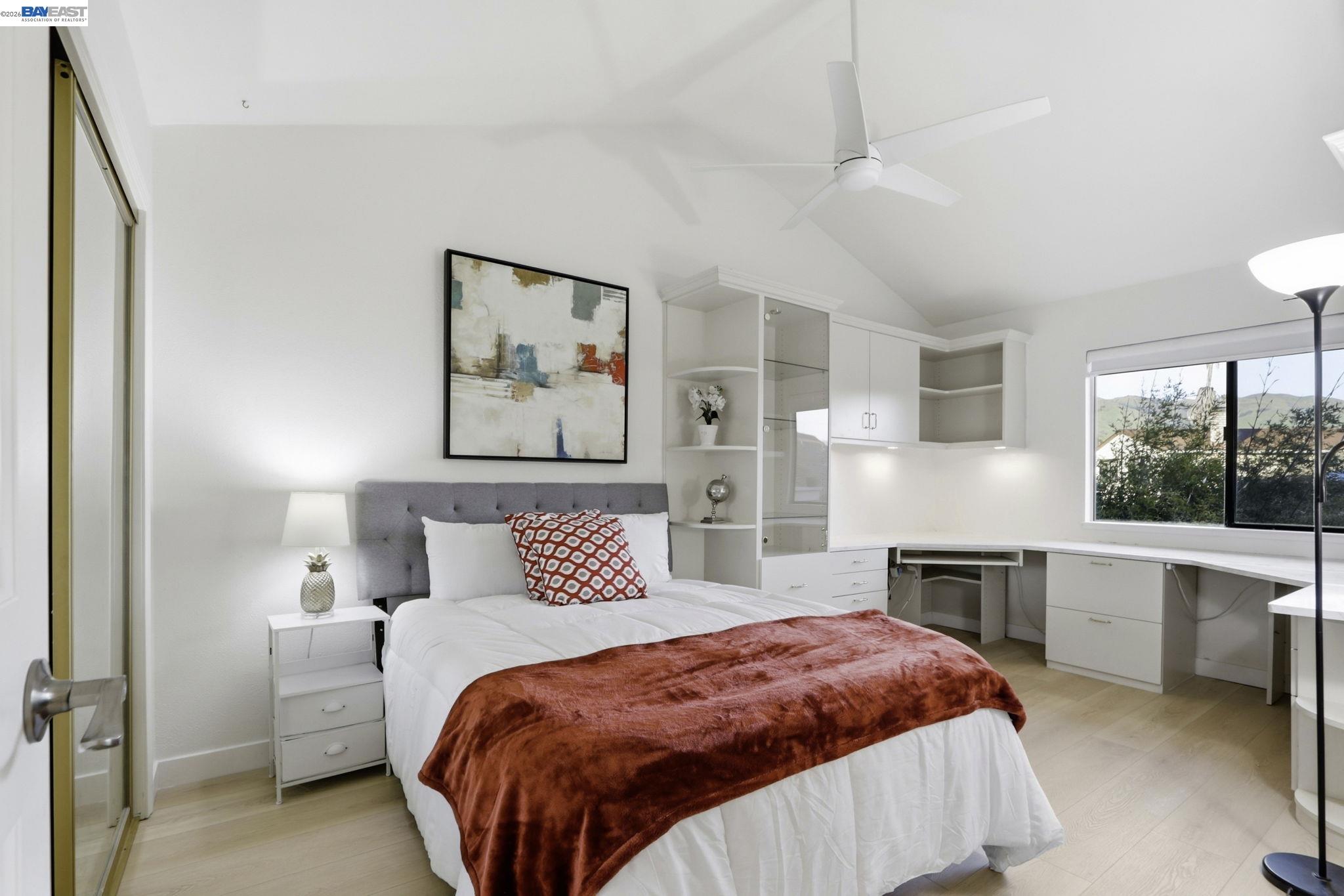 60 Jacklin Place Milpitas, CA 95035 - Photo 20 of 45 a bedroom with a large bed and a fireplace