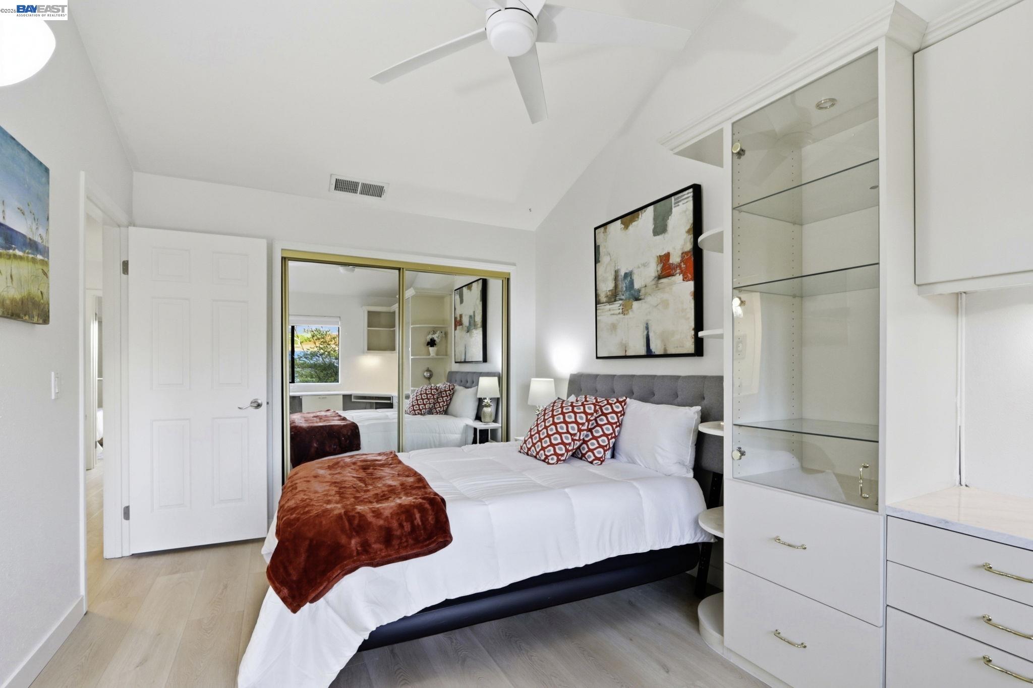 60 Jacklin Place Milpitas, CA 95035 - Photo 22 of 45 a bedroom with a large bed and a painting on the wall