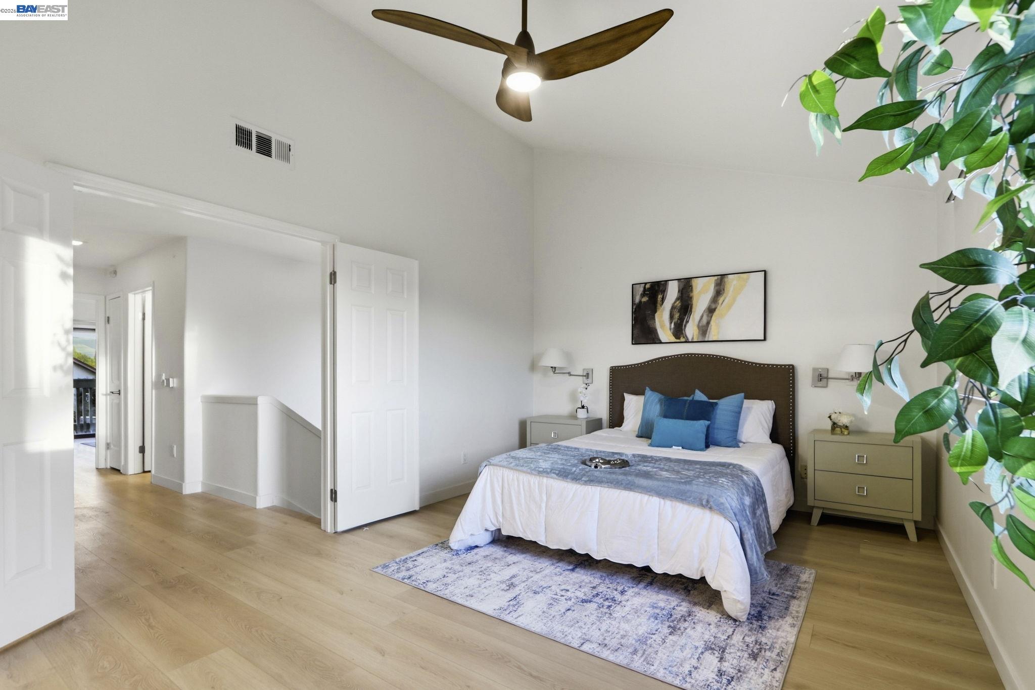 60 Jacklin Place Milpitas, CA 95035 - Photo 26 of 45 a bedroom with a bed and a potted plant