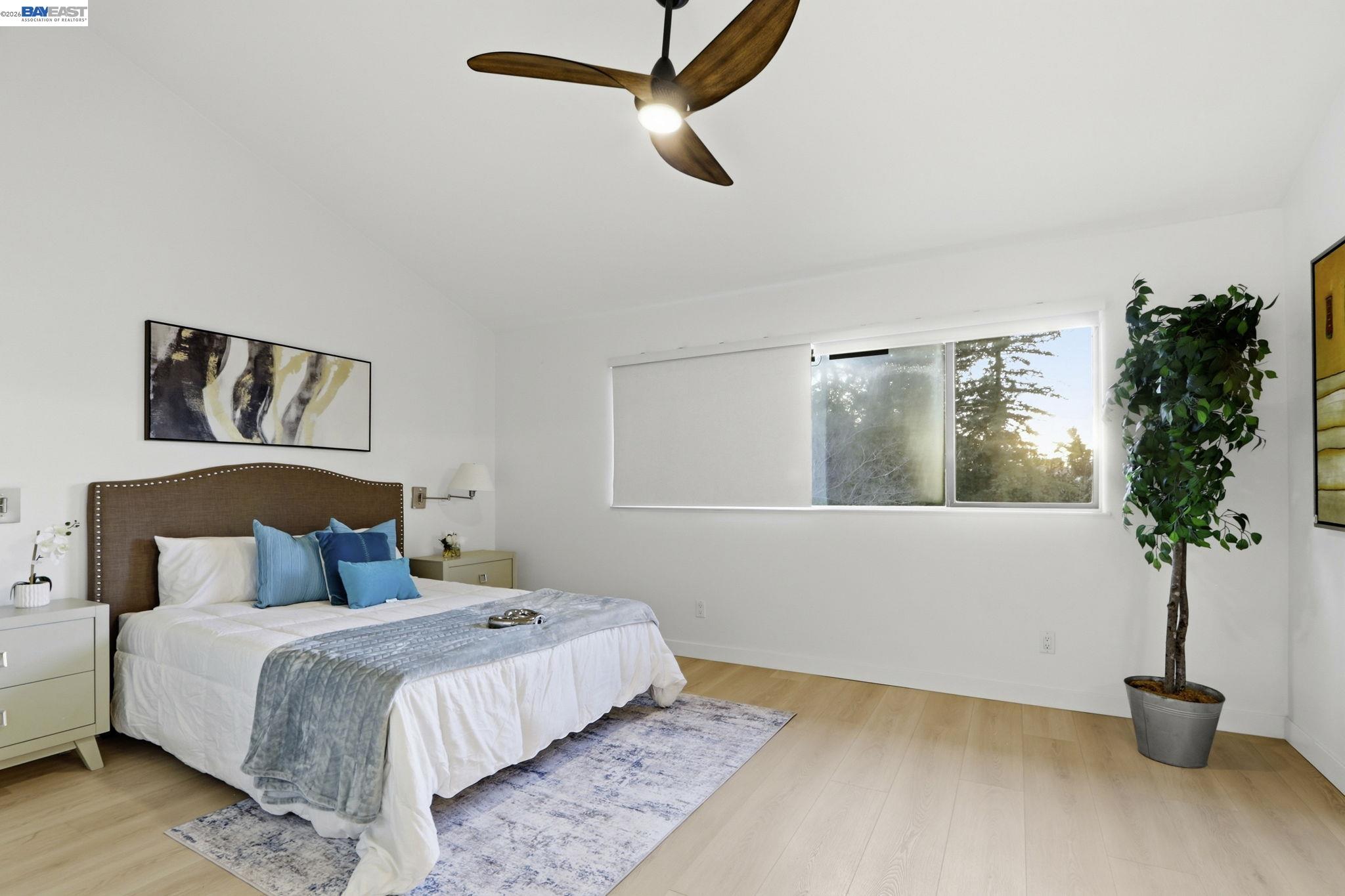 60 Jacklin Place Milpitas, CA 95035 - Photo 27 of 45 a bedroom with a bed and a potted plant