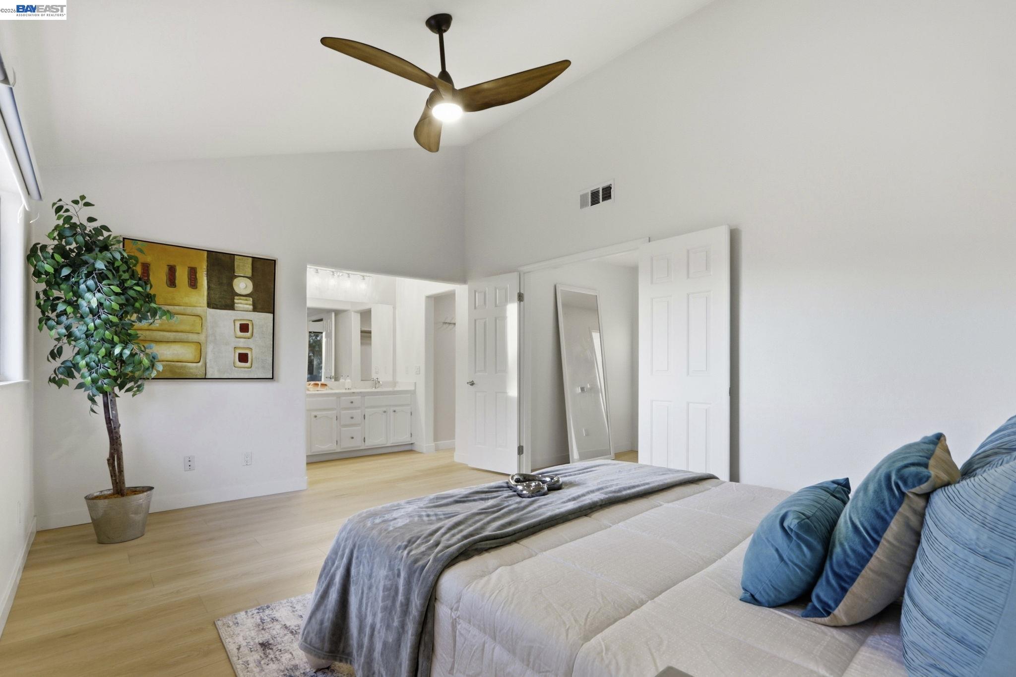 60 Jacklin Place Milpitas, CA 95035 - Photo 28 of 45 a bedroom with a large bed and a chandelier