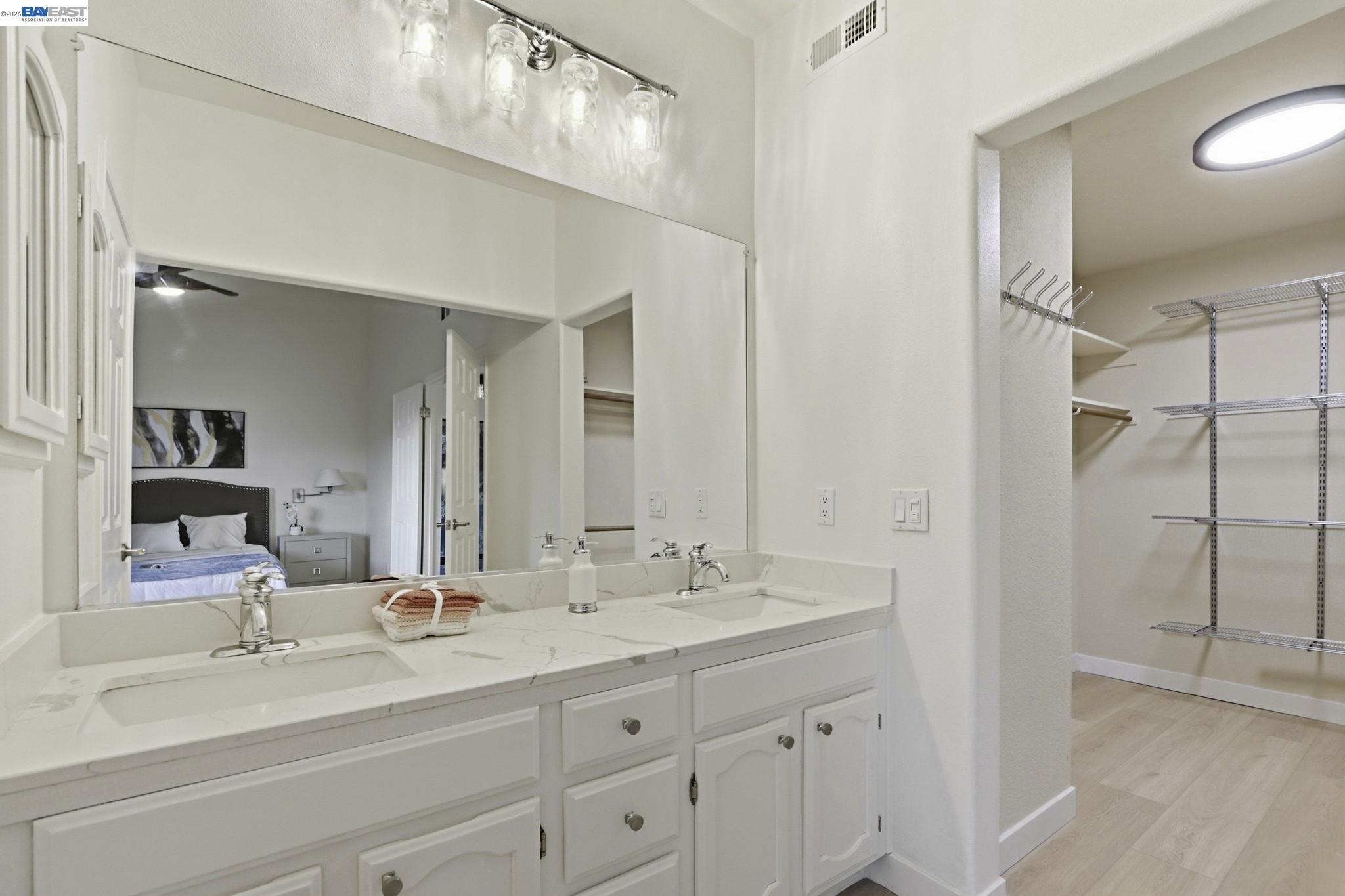 60 Jacklin Place Milpitas, CA 95035 - Photo 32 of 45 a bathroom with a sink double vanity and a mirror