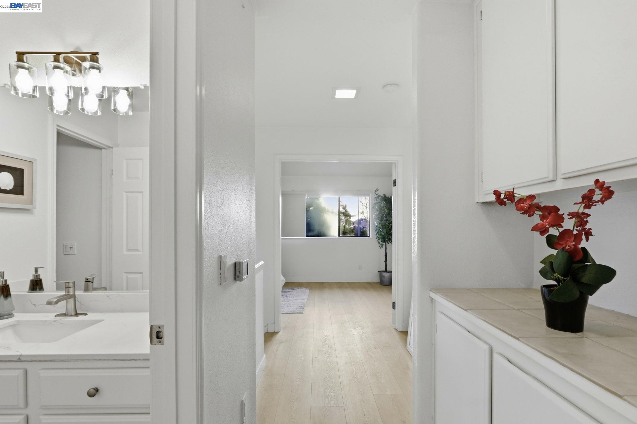 60 Jacklin Place Milpitas, CA 95035 - Photo 33 of 45 a bathroom with a granite countertop sink a potted plant and a shower