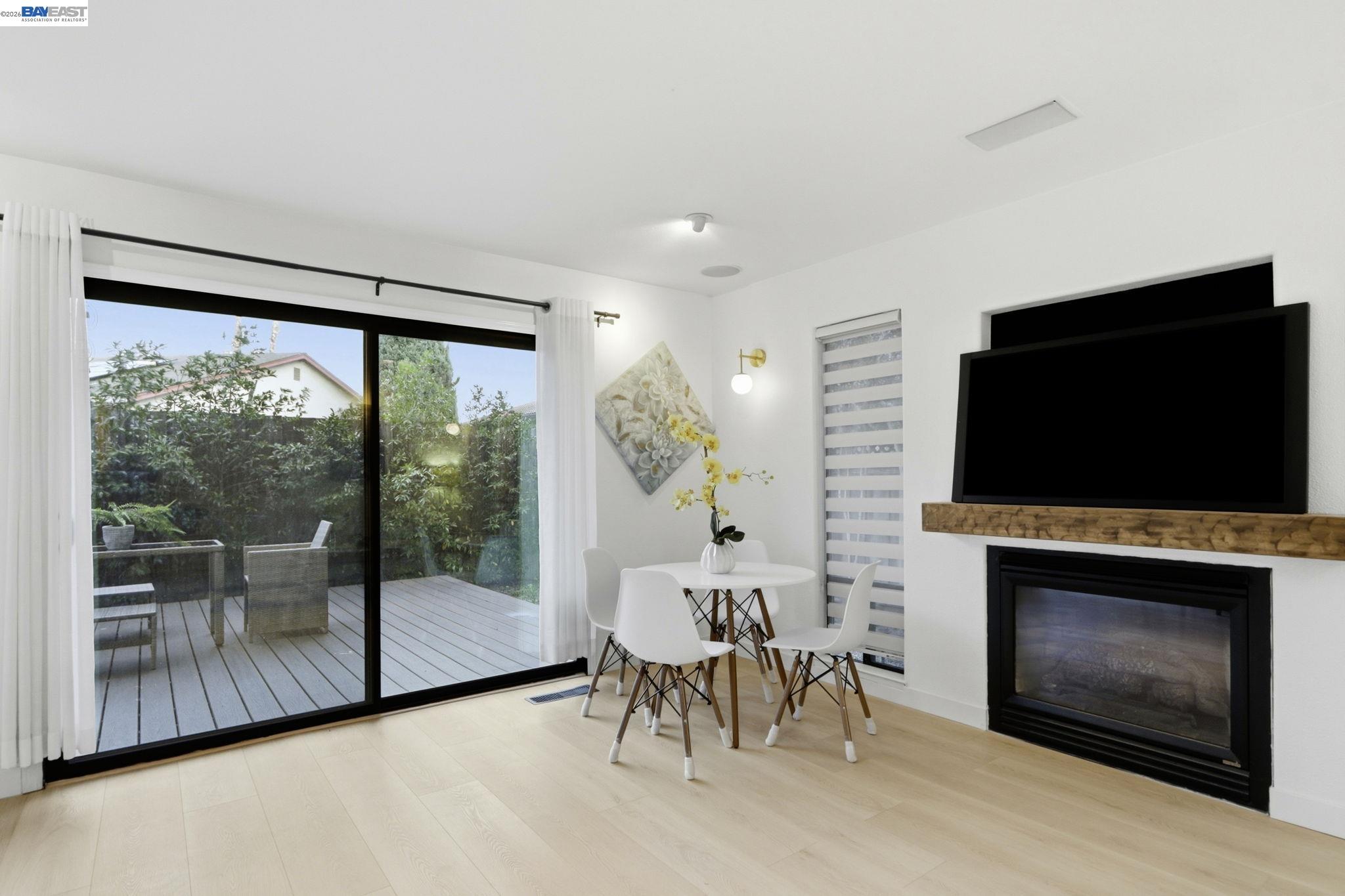 60 Jacklin Place Milpitas, CA 95035 - Photo 8 of 45 a living room with furniture a fireplace and a flat screen tv