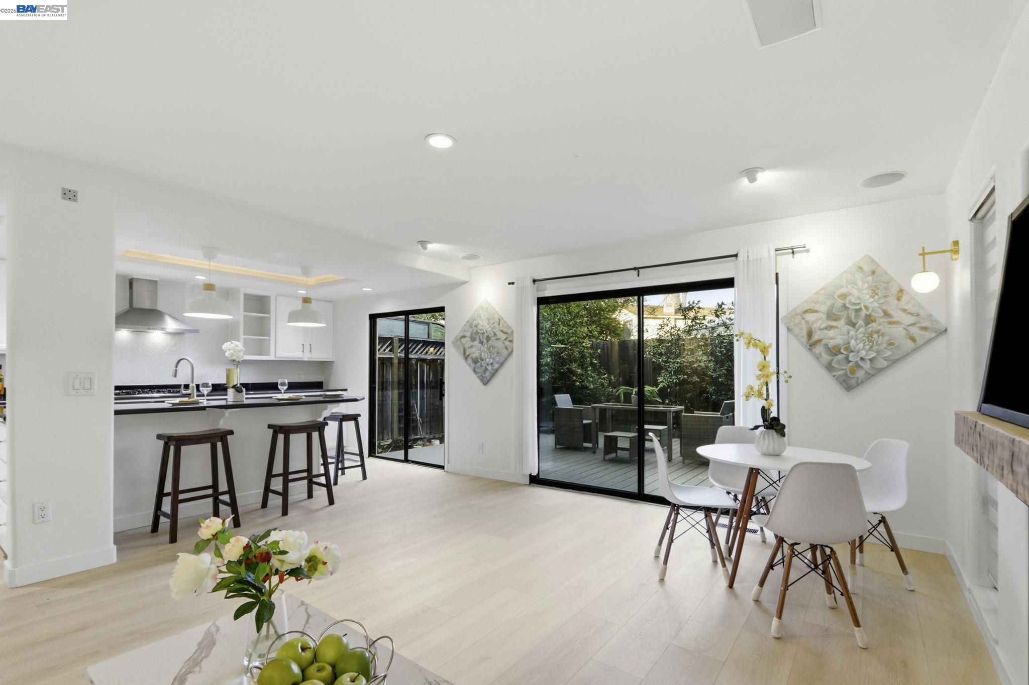 60 Jacklin Place Milpitas, CA 95035 - Photo 10 of 45 a dining room with stainless steel appliances furniture a large window and a kitchen view