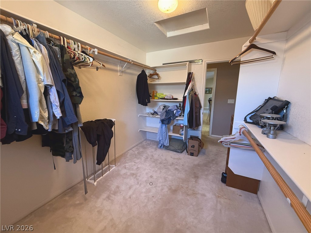 5470 Grain Mill Road Pahrump, NV 89061 - Photo 21 of 80 A spacious walk-in closet provides abundant hanging rods and built-in shelving.