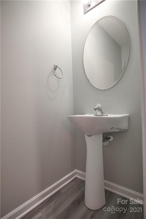 3235 Blythe Ridge Court Charlotte, NC 28213 - Photo 5 of 14 a bathroom with a sink and mirror