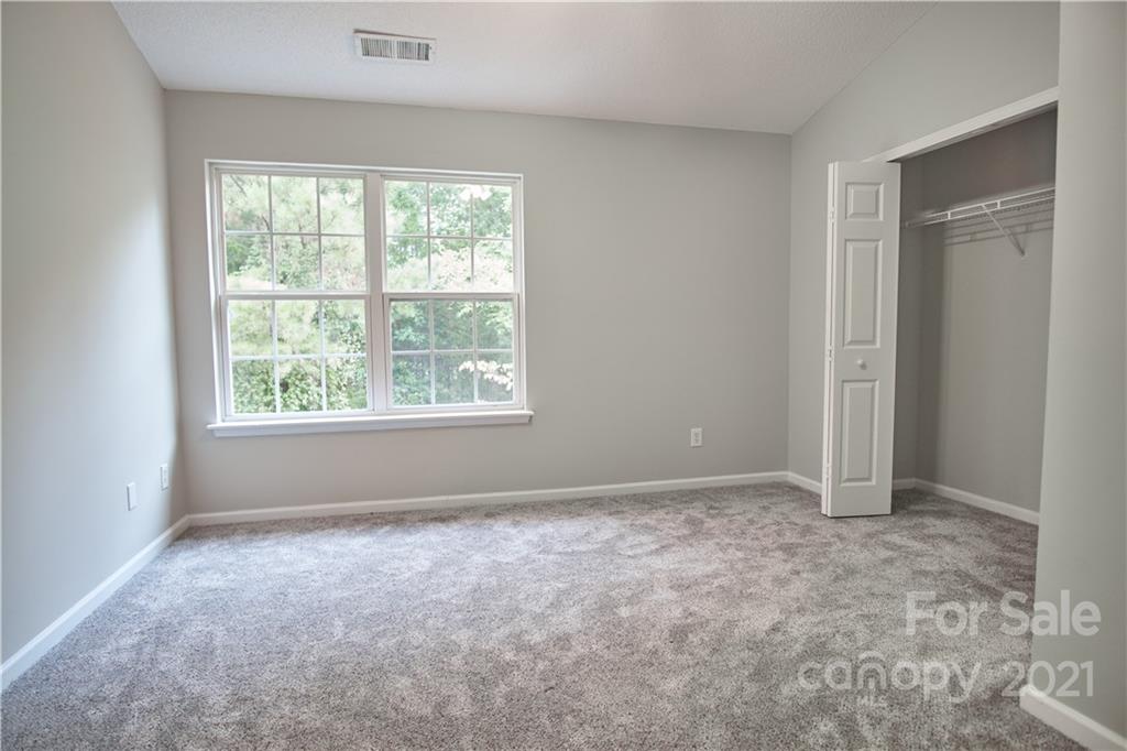 3235 Blythe Ridge Court Charlotte, NC 28213 - Photo 10 of 14 an empty room with windows