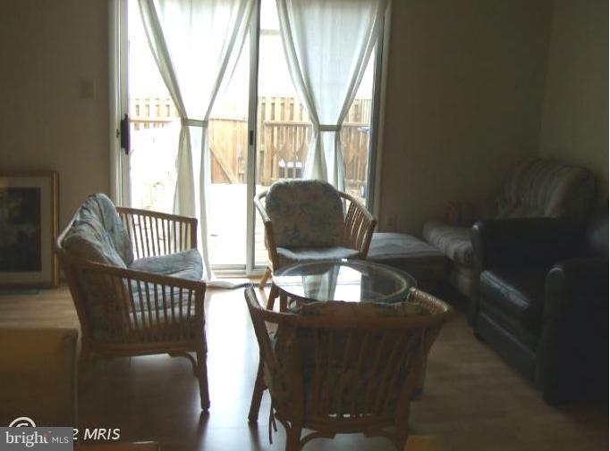 23 Cross Ridge Court Germantown, MD 20874 - Photo 4 of 19 a living room with furniture and a large window