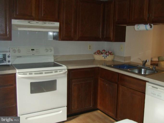 23 Cross Ridge Court Germantown, MD 20874 - Photo 7 of 19 a kitchen with a sink and cabinets