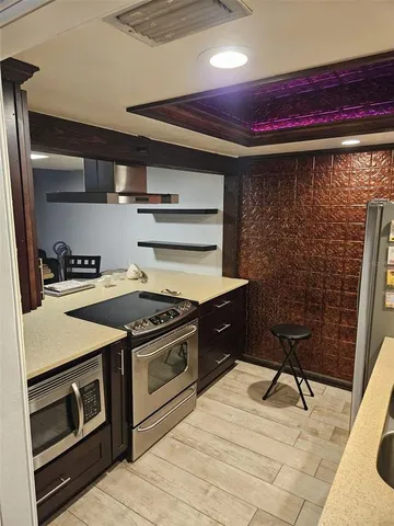 a kitchen with a stove and a microwave