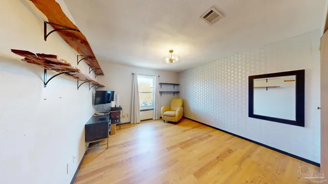 a view of a room with a flat screen tv