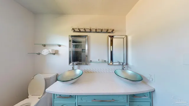 a bathroom with a shower and a toilet