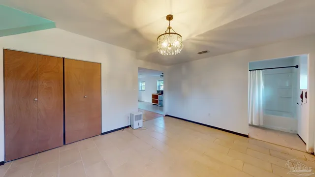 a bathroom with a tub a sink and a shower