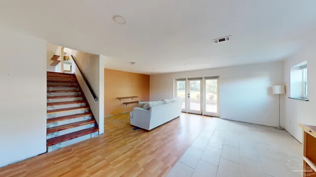 a view of balcony with wooden floor