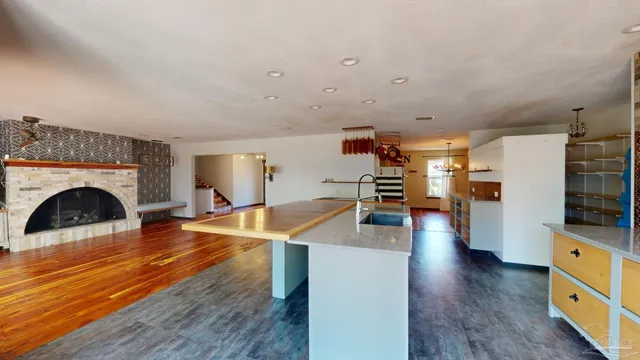 a view of a livingroom with furniture and a fireplace