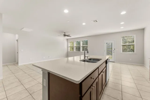 a kitchen with stainless steel appliances a refrigerator and a stove top oven