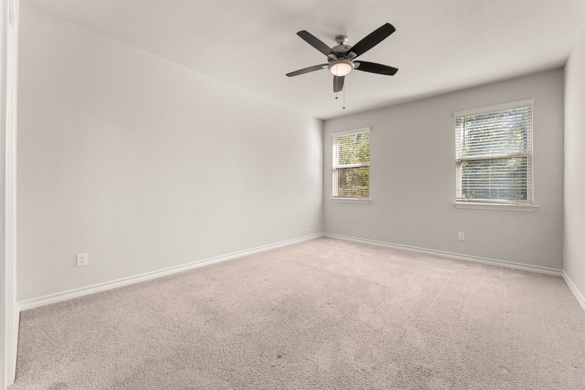 740 Aliso Trail Leander, TX 78641 - Photo 15 of 35 an empty room with a window and a fan