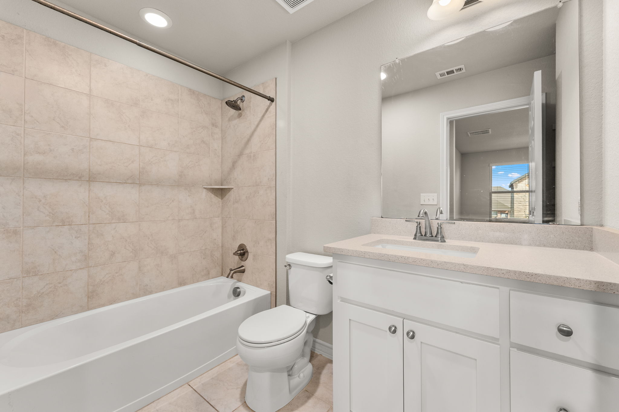 740 Aliso Trail Leander, TX 78641 - Photo 26 of 35 The full guest bathroom features a spacious vanity with ample counter space.