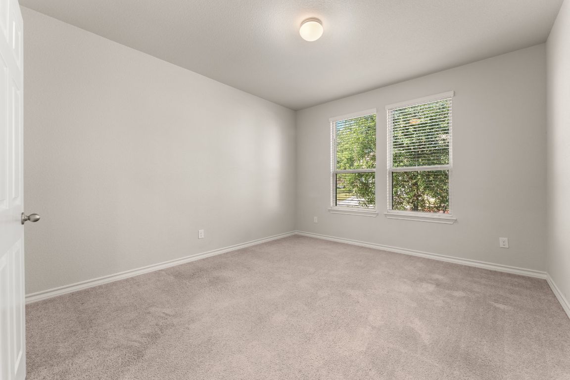 740 Aliso Trail Leander, TX 78641 - Photo 4 of 35 an empty room with windows