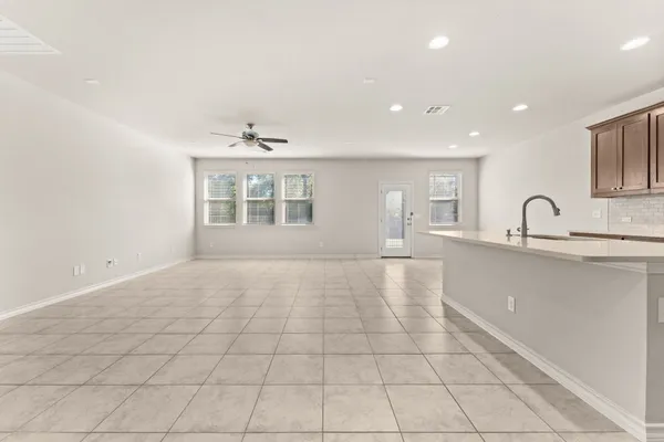 a view of a kitchen with a sink and a window