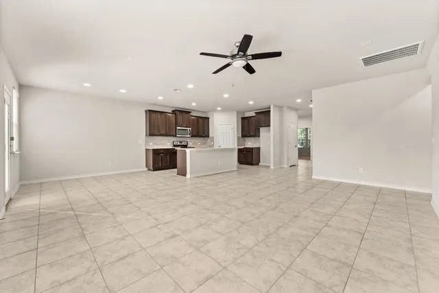 a view of a kitchen with a dishwasher and a refrigerator
