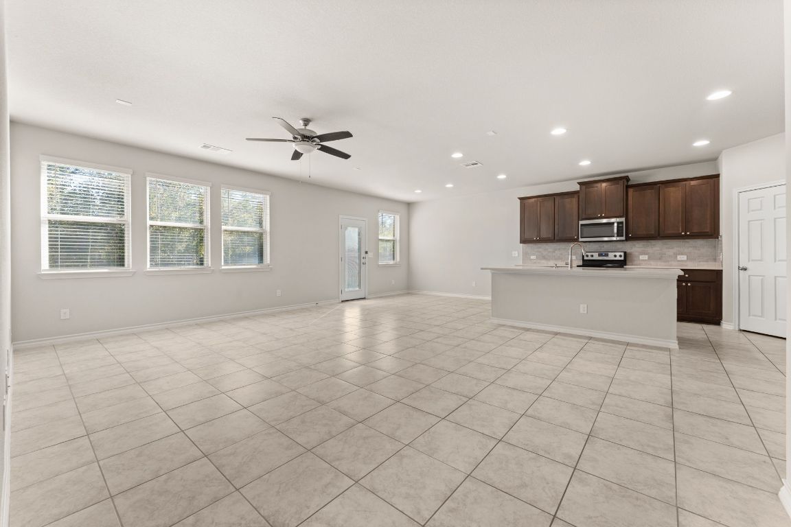 740 Aliso Trail Leander, TX 78641 - Photo 7 of 35 a view of a kitchen with furniture and a kitchen