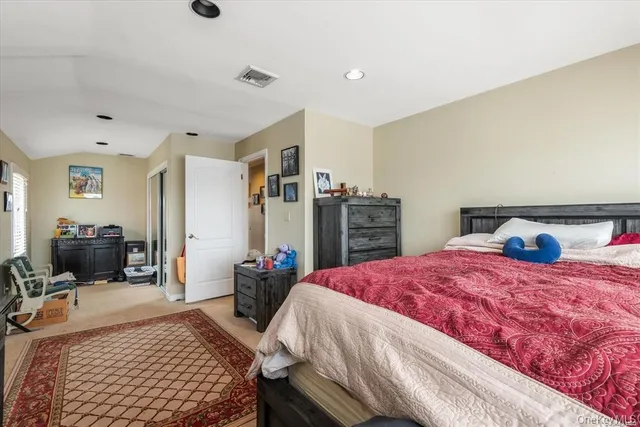 a bed room with a bed and a television