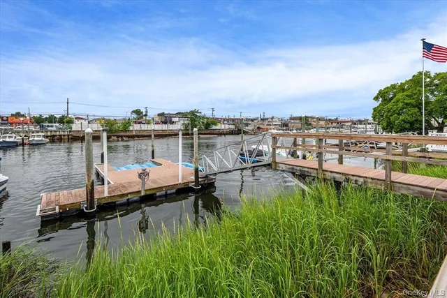 a view of a lake with a house in the background