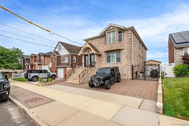 a view of a car park in front of house
