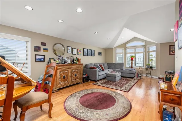 a living room with furniture a rug and a fireplace