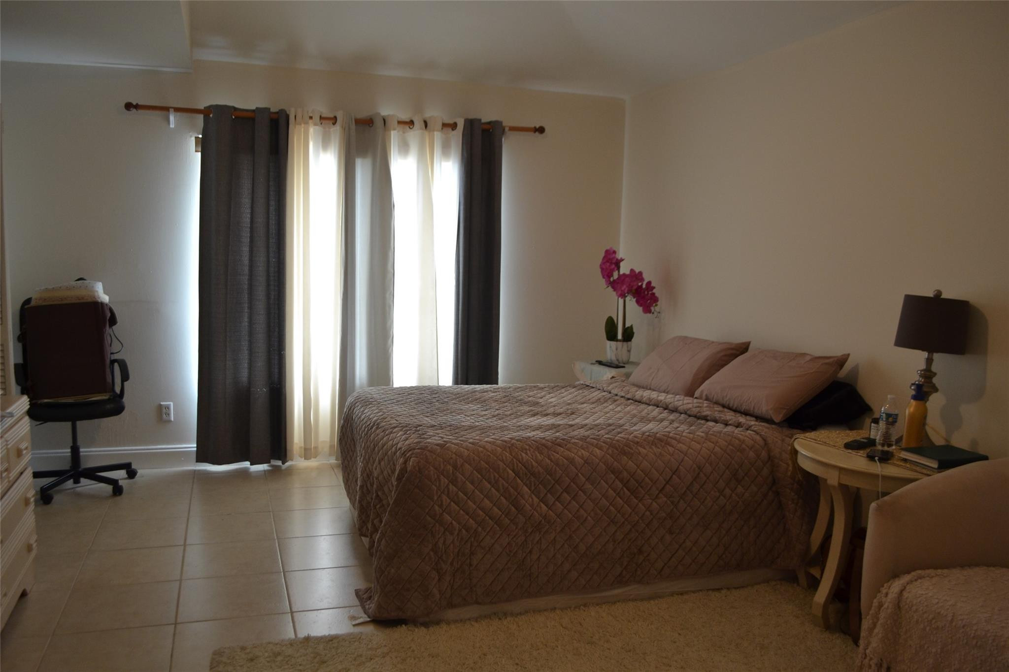 3539 Inverrary Boulevard West Lauderhill, FL 33319 - Photo 13 of 33 a bed room with a bed and a chair