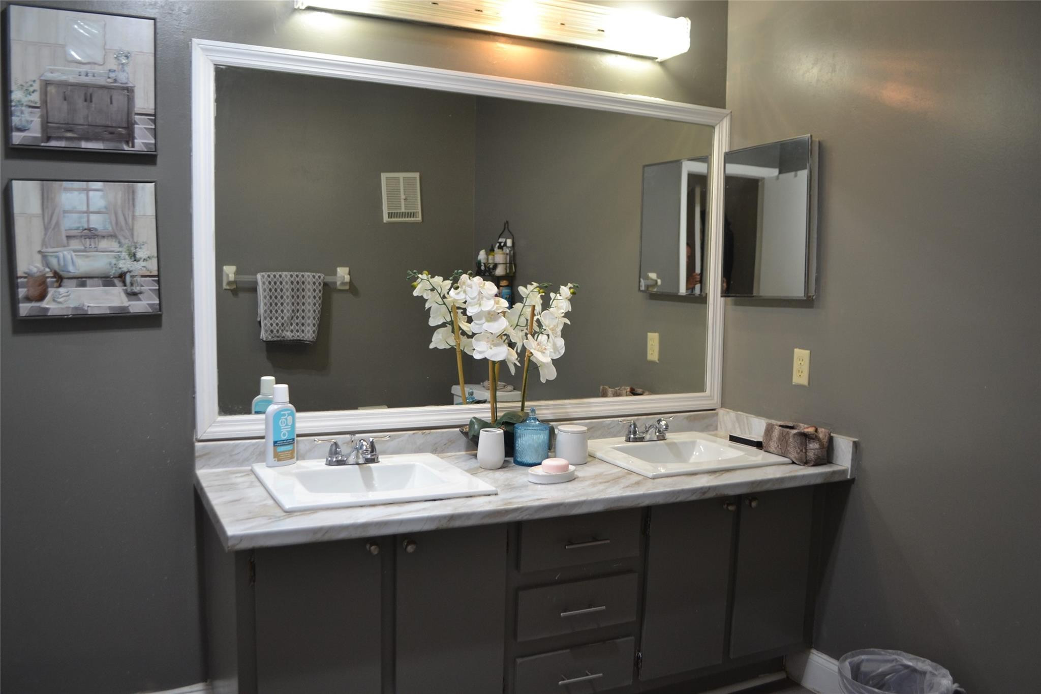 3539 Inverrary Boulevard West Lauderhill, FL 33319 - Photo 16 of 33 a bathroom with a sink and two mirror