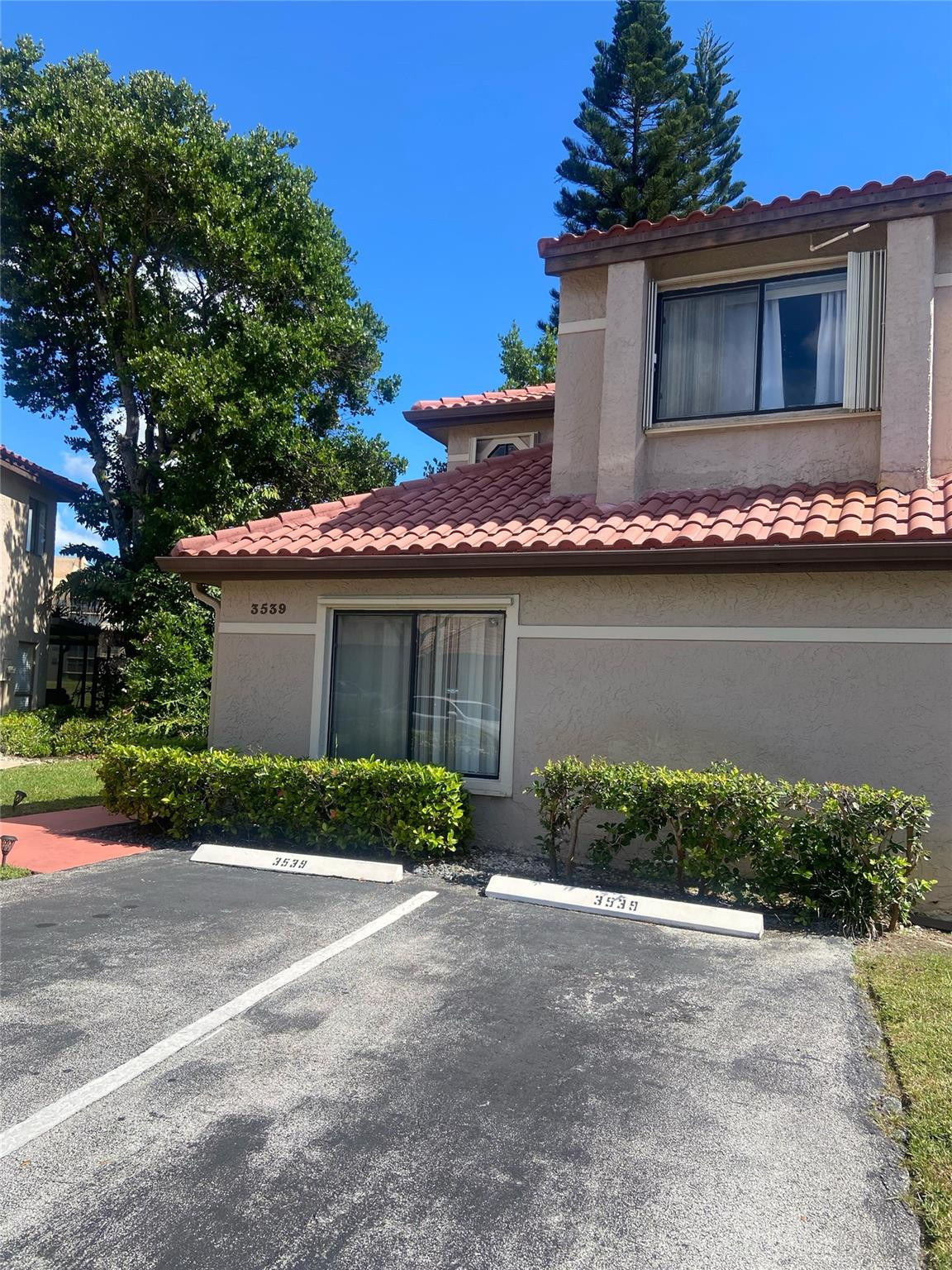 3539 Inverrary Boulevard West Lauderhill, FL 33319 - Photo 2 of 33 a front view of a house with garden