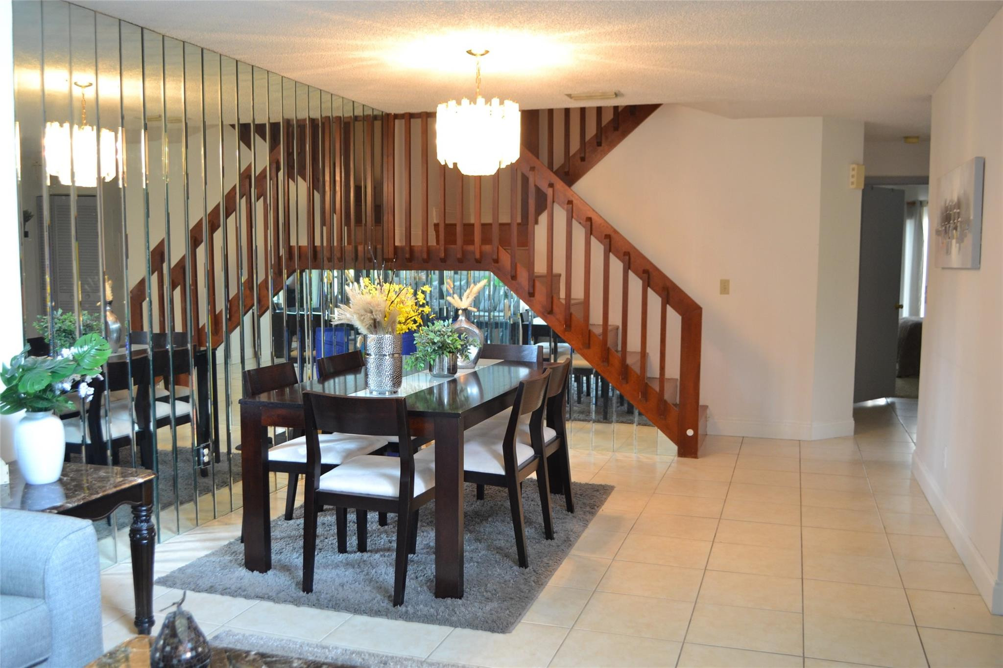 3539 Inverrary Boulevard West Lauderhill, FL 33319 - Photo 3 of 33 a view of a dining room with furniture and chandelier