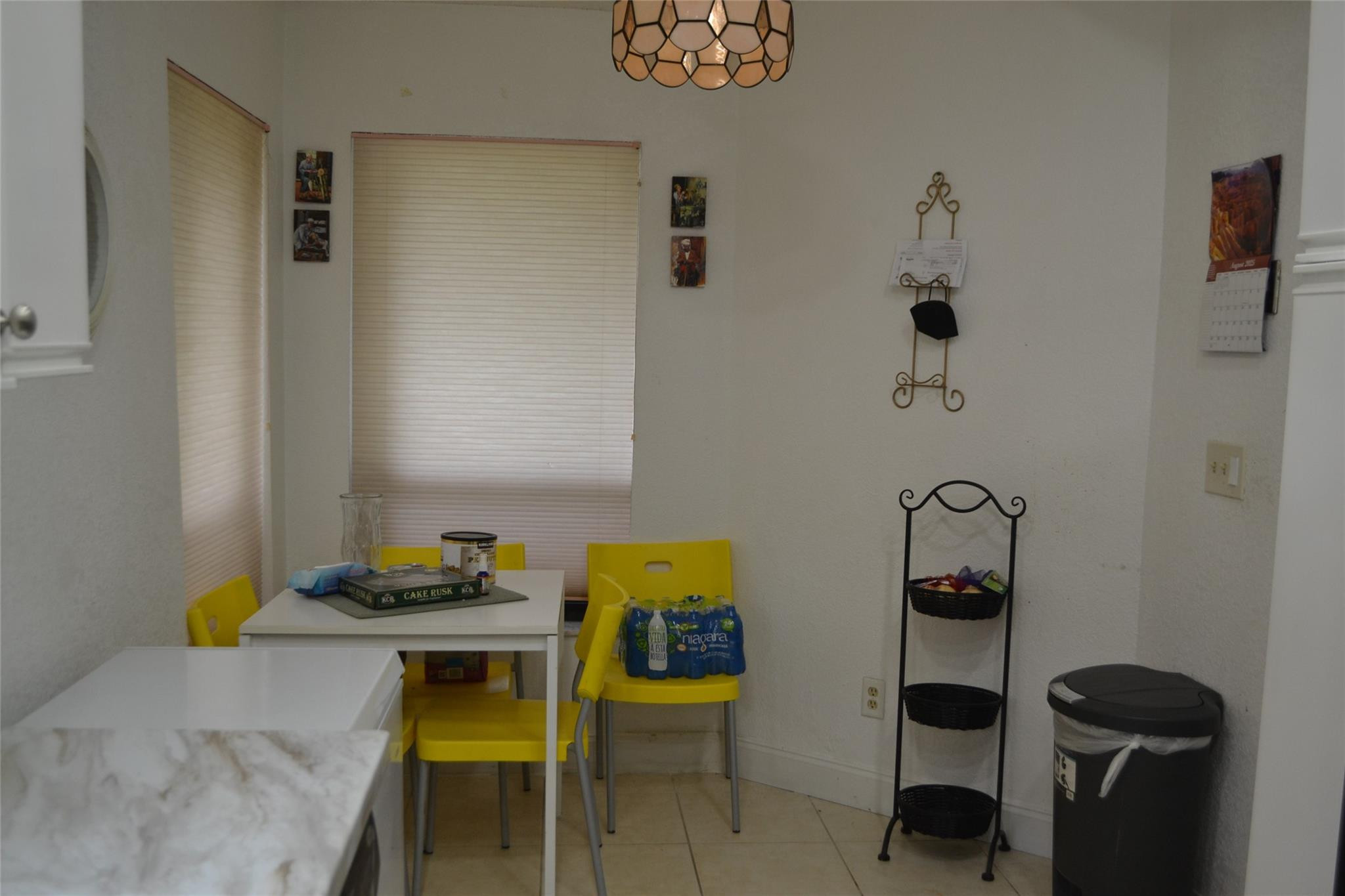 3539 Inverrary Boulevard West Lauderhill, FL 33319 - Photo 7 of 33 a dining room with a table and chairs