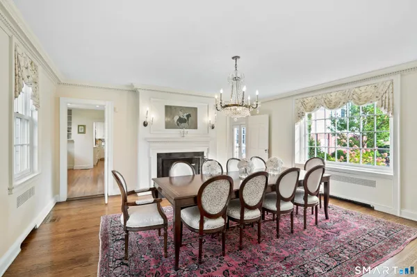 a view of a dining room with furniture window and wooden floor