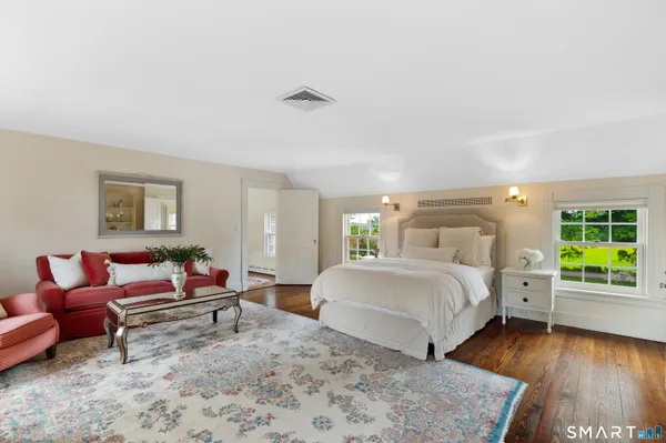 a bedroom with a bed and a couch