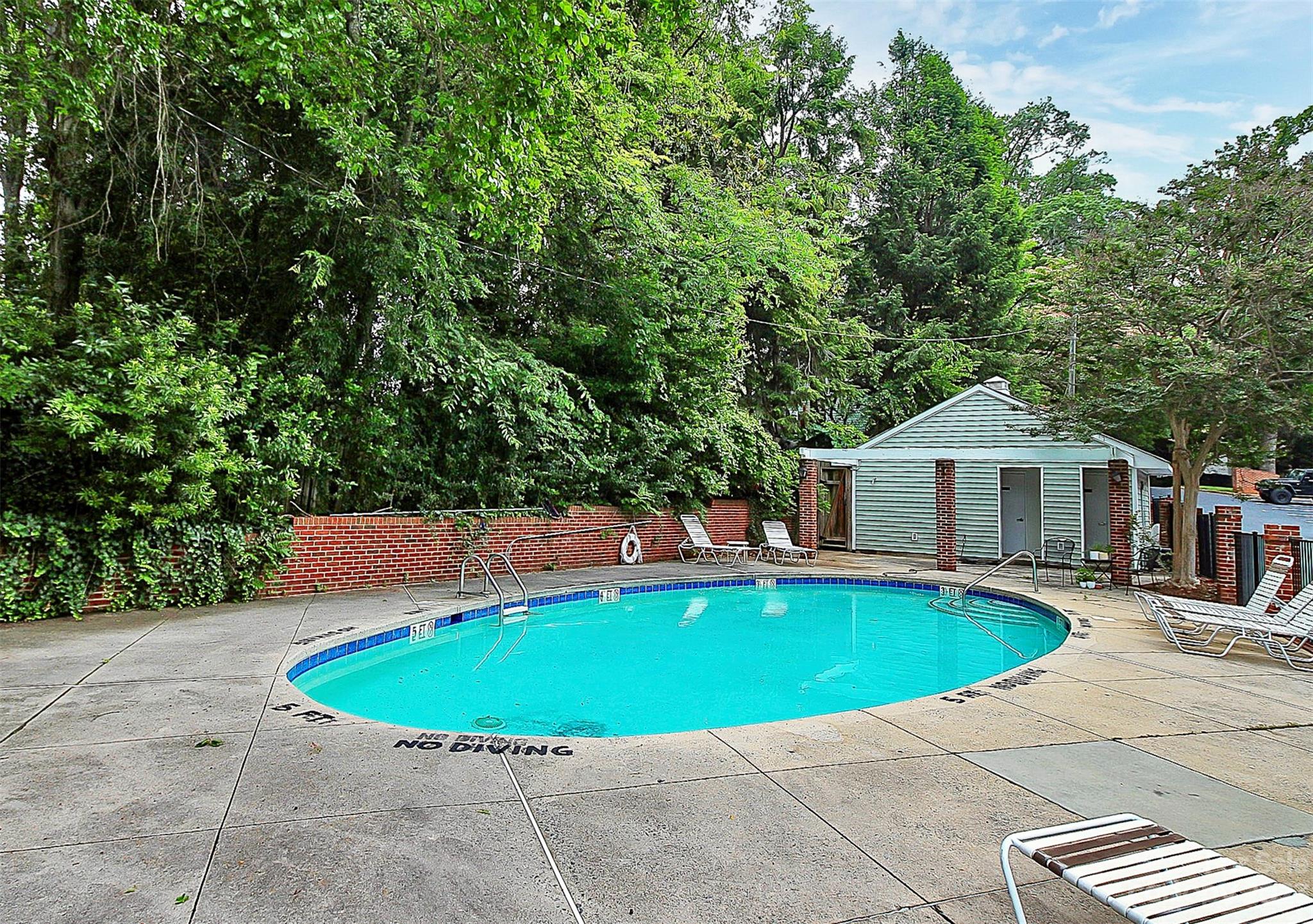 430 Queens Road, Unit 212 Charlotte, NC 28207 - Photo 3 of 23 a view of a swimming pool with a patio